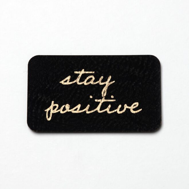 Kunstlederlabel stay positive (schwarz/gold)