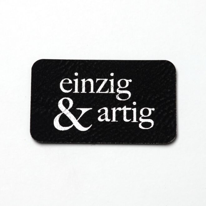 Kunstlederlabel einzig&artig (schwarz/silber)